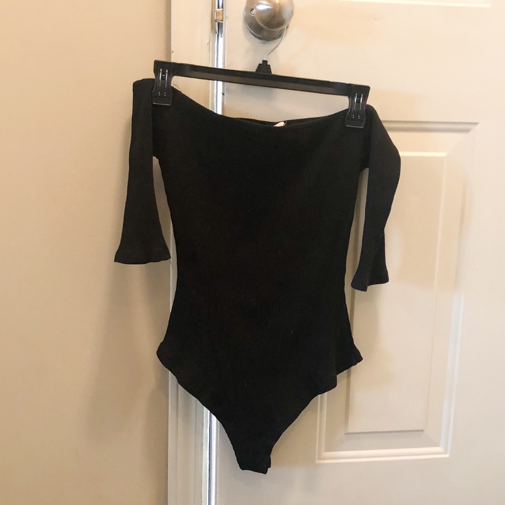Off the shoulder black ribbed body suit.